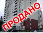 В новом жилом доме на первом этаже.